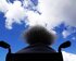 Man sieht Rücken von Mann in Rollstuhl und blauen Himmel mit ein paar Wolken. | © James Williams/ unsplash